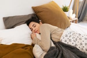 woman sleeping peacefully bed